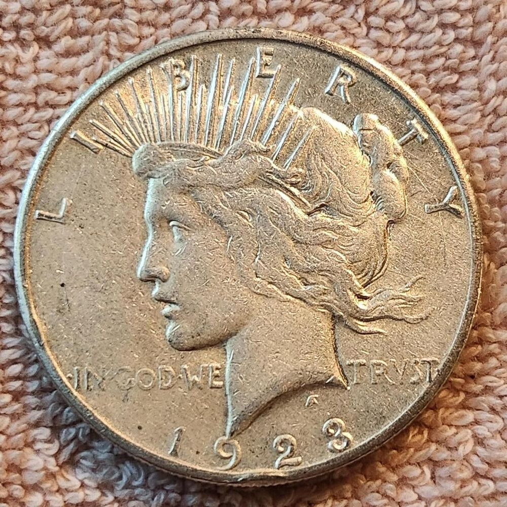 1923 Peace Dollar, Estimated grade VF-30
90%...